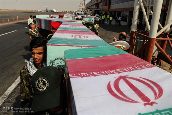 ورود پیکر ۱۸ شهید گمنام دفاع مقدس از طریق فرودگاه اهواز 9