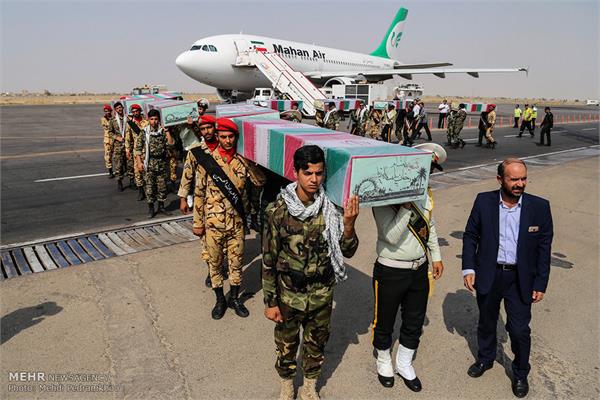 ورود پیکر ۱۸ شهید گمنام دفاع مقدس از طریق فرودگاه اهواز 12